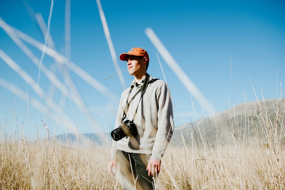 cinematographer with camera in field